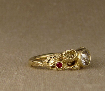 Carved Poppy ring with oval diamond and rubies, 18K