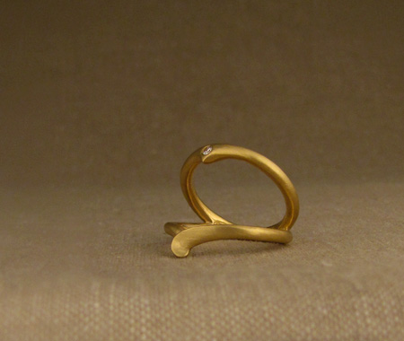 hand-carved split-ring in 22K with 2mm diamond