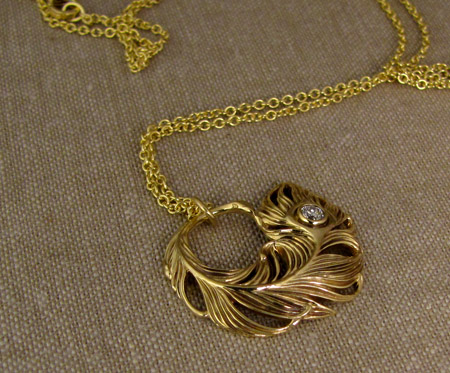 Hand-carved peacock feather pendant in 18K with 3mm OEC diamond