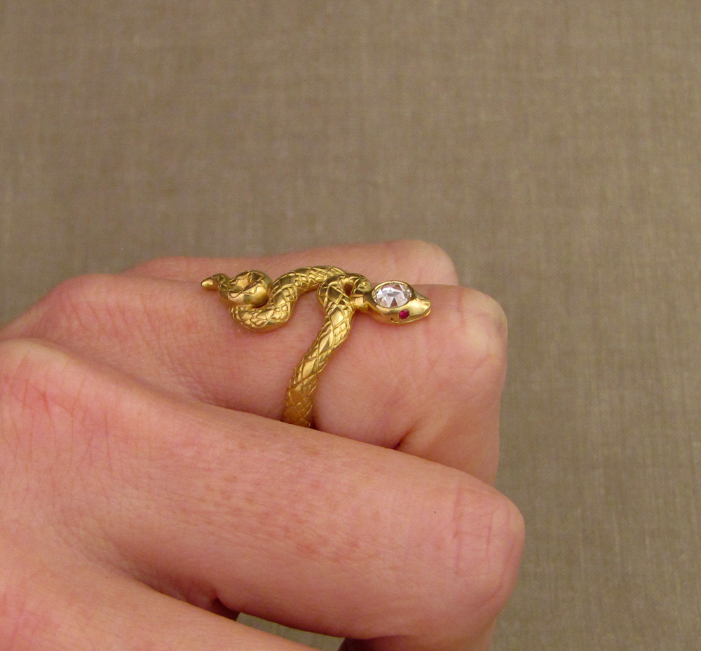 Custom designed & hand-carved snake ring with diamond head and ruby eyes, 22K gold