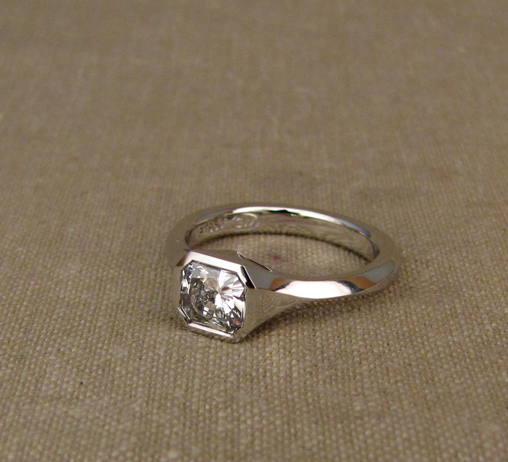 Custom hand-carved geometric solitaire for a 1ct+ radiant-cut diamond, platinum 950