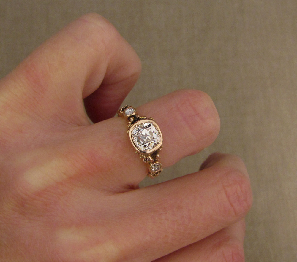 Custom designed & hand-carved Peach Blossom Solitaire bezel set with 1.39ct antique Old Mine Cut diamond, 19K rose gold.