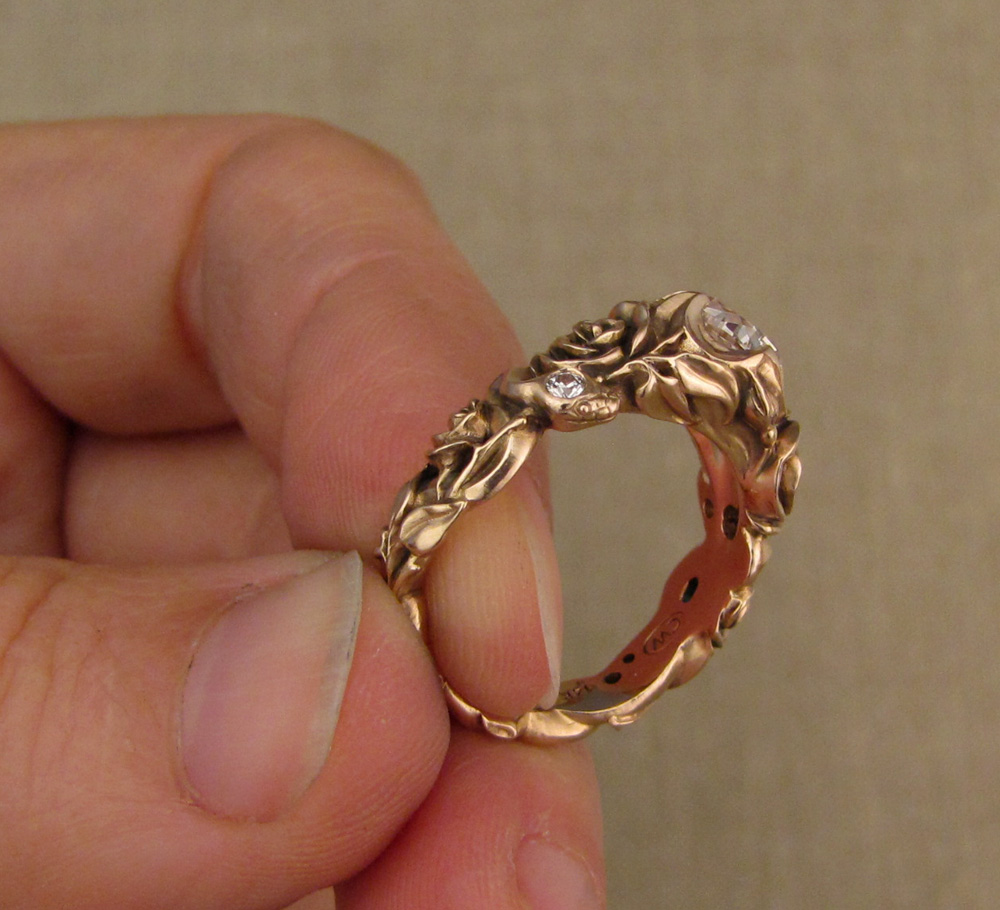 Custom designed & hand-carved Pink diamond solitaire set in quatrefoil setting with snakes and roses, 14K rose gold