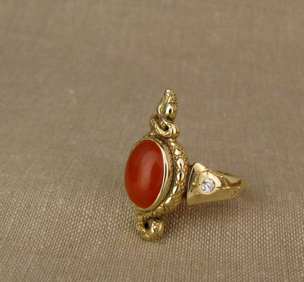 Custom designed & hand-carved Snake ring set with carnelian and antique Old European cut diamonds; cicada & Pleiades motifs on shoulders, dogwood blossom on the base. 