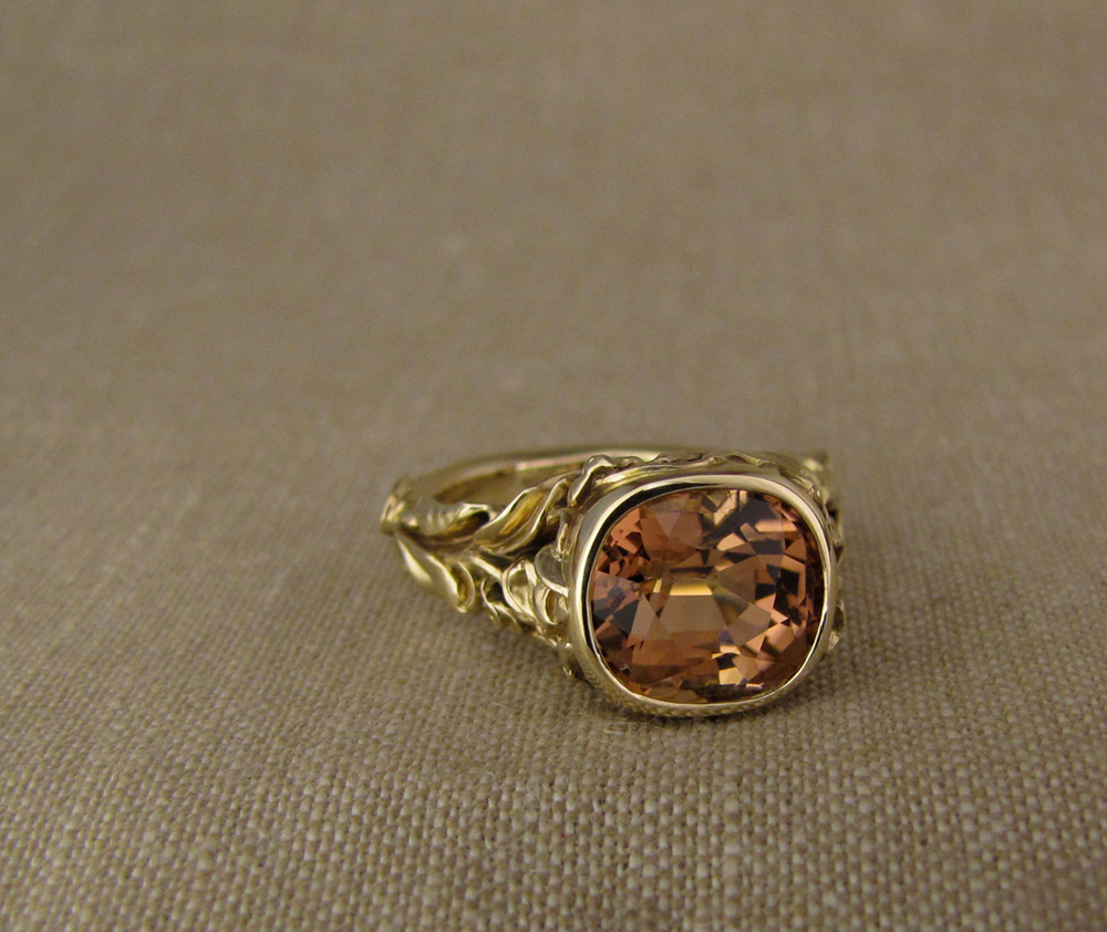 Custom designed & hand-carved Peach Tourmaline Solitaire with Sweet Peas motif, 14K gold