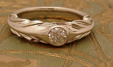 18 white gold and diamond hand-carved ring