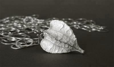 Cast silver hollow seedpod w/hammered chain