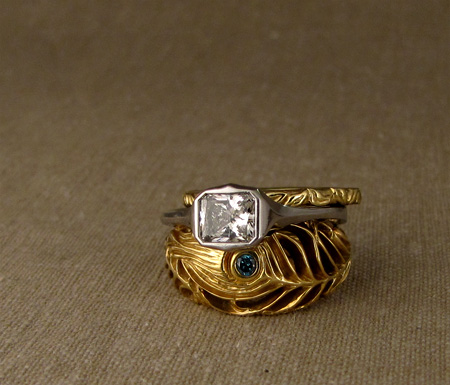 Art Deco-style platinum solitaire with 18K yellow Peacock feather ring