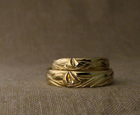 Hand-carved sailboat wedding bands