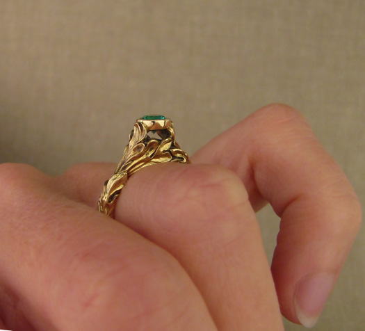 Hand-carved Rococo Leaves Emerald Solitaire in 18K gold
