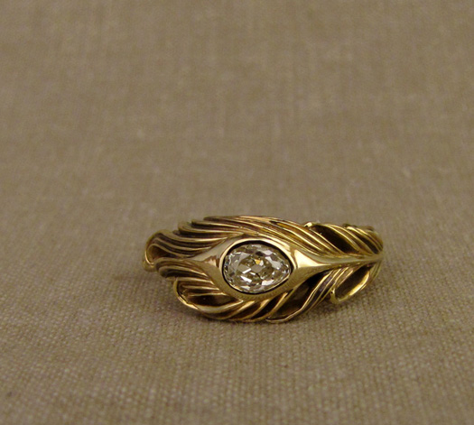 Custom-designed & hand-carved peacock feather ring with an antique pear diamond, 18K gold