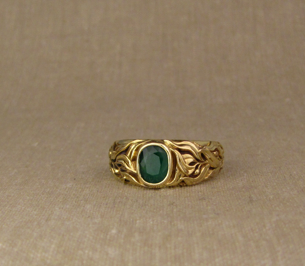 Custom designed & hand-carved Laurel motif Emerald Solitaire in 18K gold