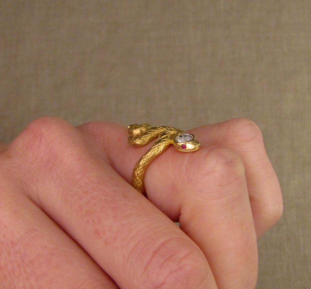 Custom designed & hand-carved snake ring with diamond head and ruby eyes, 22K gold