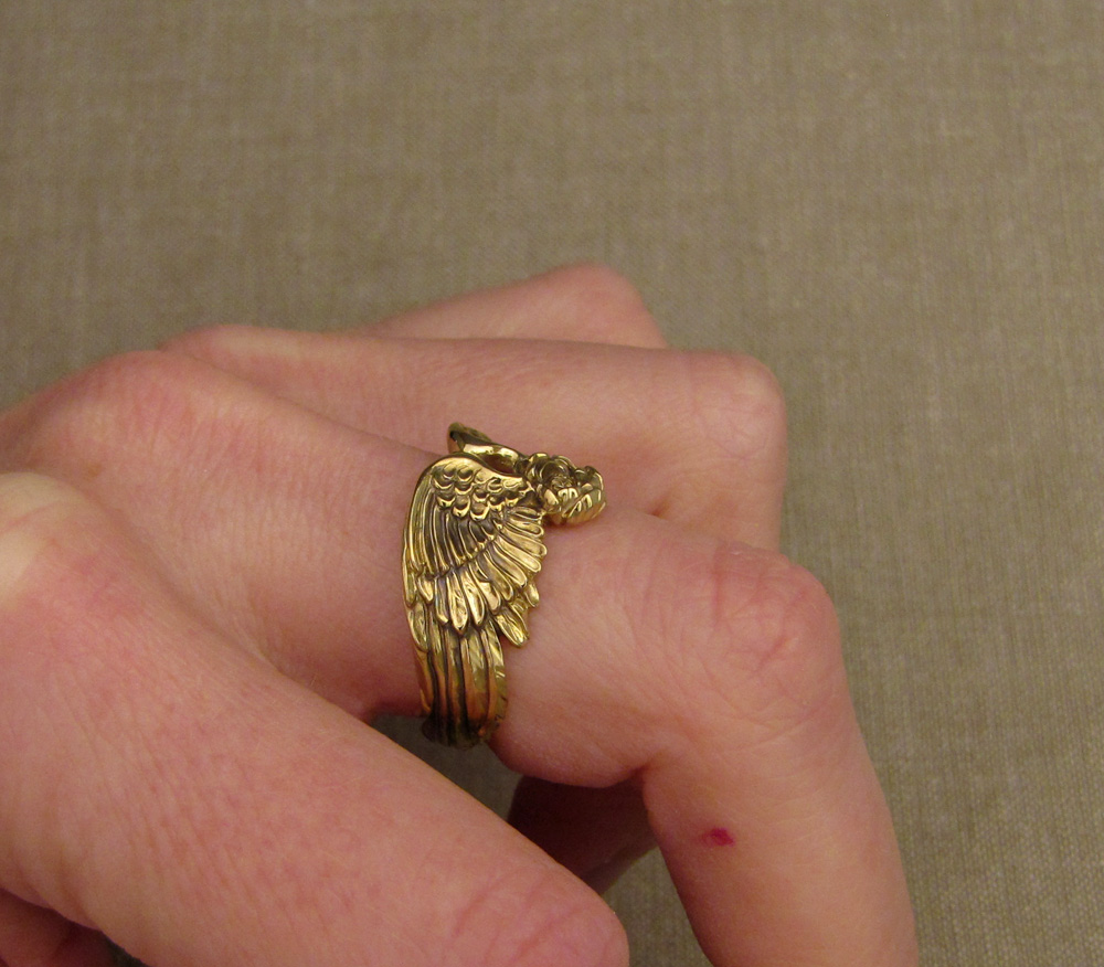 Hand-carved custom winged band with peony bloom and tiny engraved birds inside the band, 18K gold
