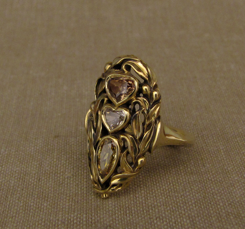 18K hand-carved olive branch navette ring, set with fancy colored+cut diamonds