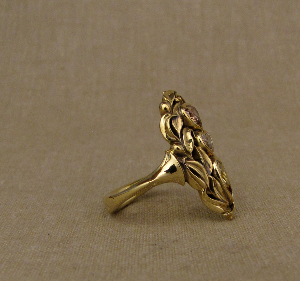 18K hand-carved olive branch navette ring, set with fancy colored+cut diamonds