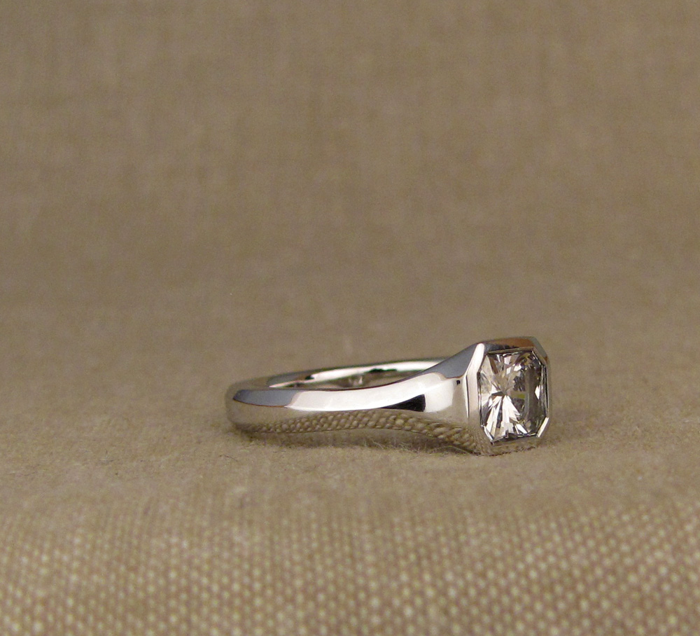 Custom hand-carved geometric solitaire for a 1ct+ radiant-cut diamond, platinum 950