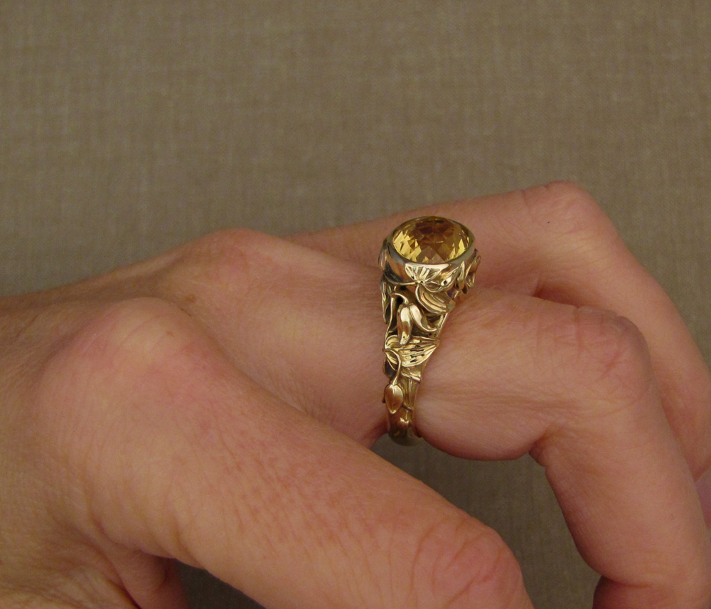 Custom designed & hand-carved citrine solitaire with clematic flower motif, 14K yellow gold