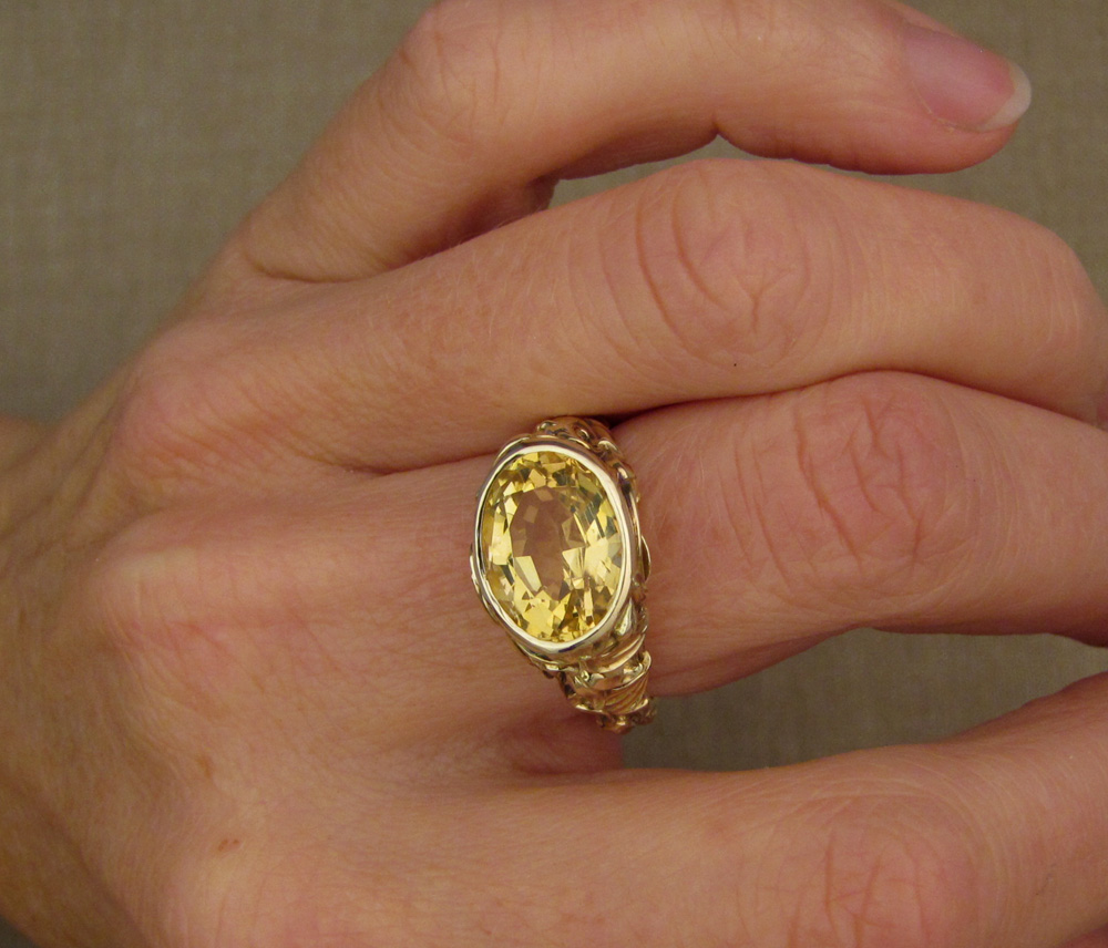 Custom designed & hand-carved citrine solitaire with clematic flower motif, 14K yellow gold