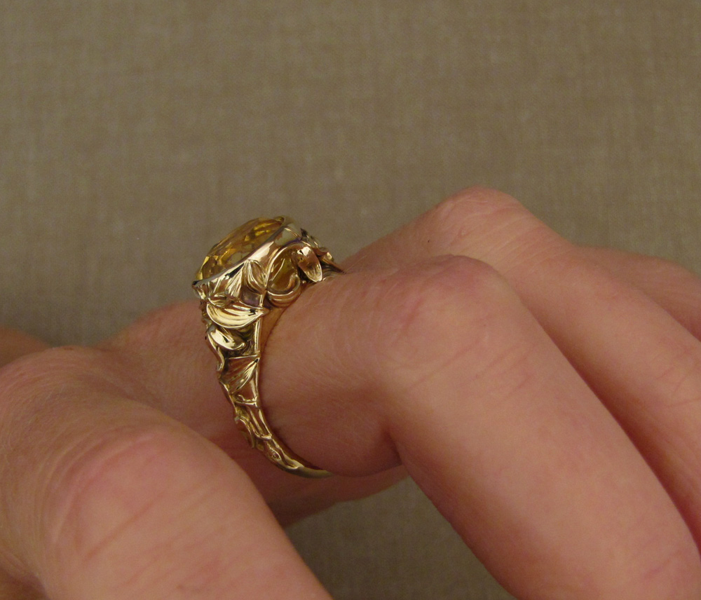 Custom designed & hand-carved citrine solitaire with clematic flower motif, 14K yellow gold