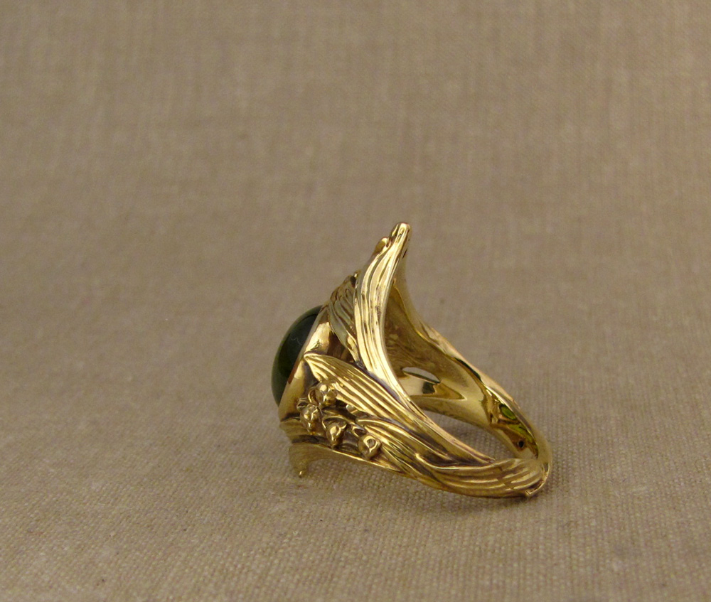 Custom-designed & hand-carved Lily of the Valley Solitaire set with absinthe-green demantoid garnet. 18K gold.