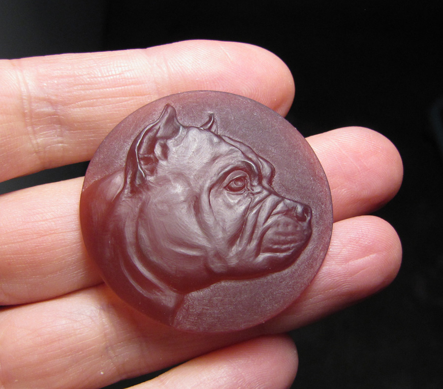 Custom designed & hand-carved bulldog pet portrait pendant. Wax model prior to casting.
