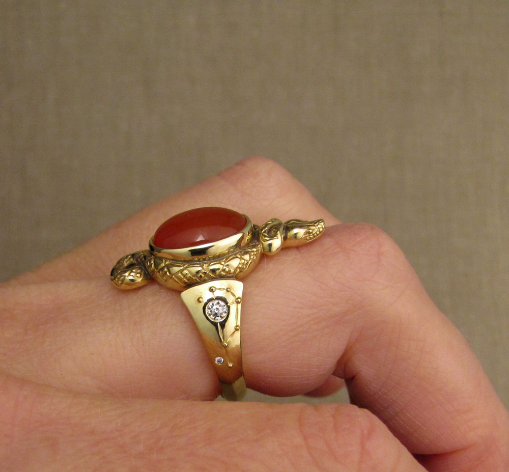 Custom designed & hand-carved Snake ring set with carnelian and antique Old European cut diamonds; cicada & Pleiades motifs on shoulders, dogwood blossom on the base. 