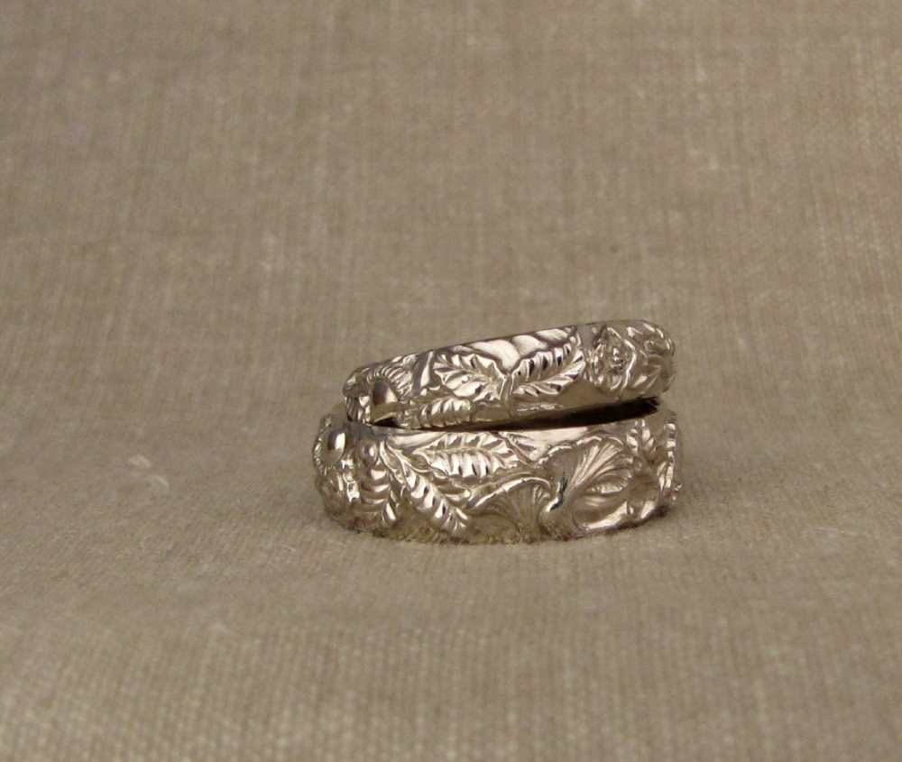 Custom hand-carved wedding bands with Tanoak/Chanterelle/California Poppy motifs, 14K palladium white gold