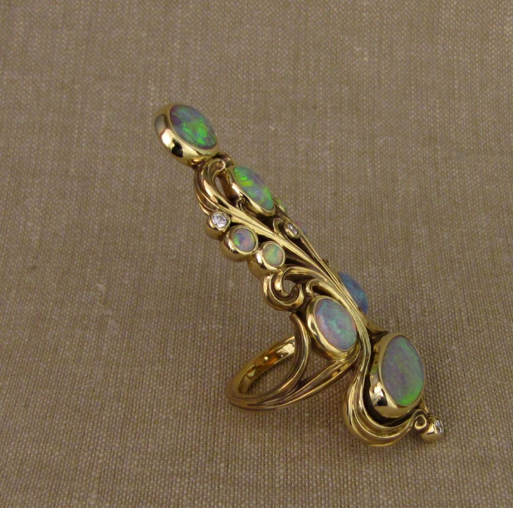 Hand-carved art nouveau Opal and 18K gold epic ring