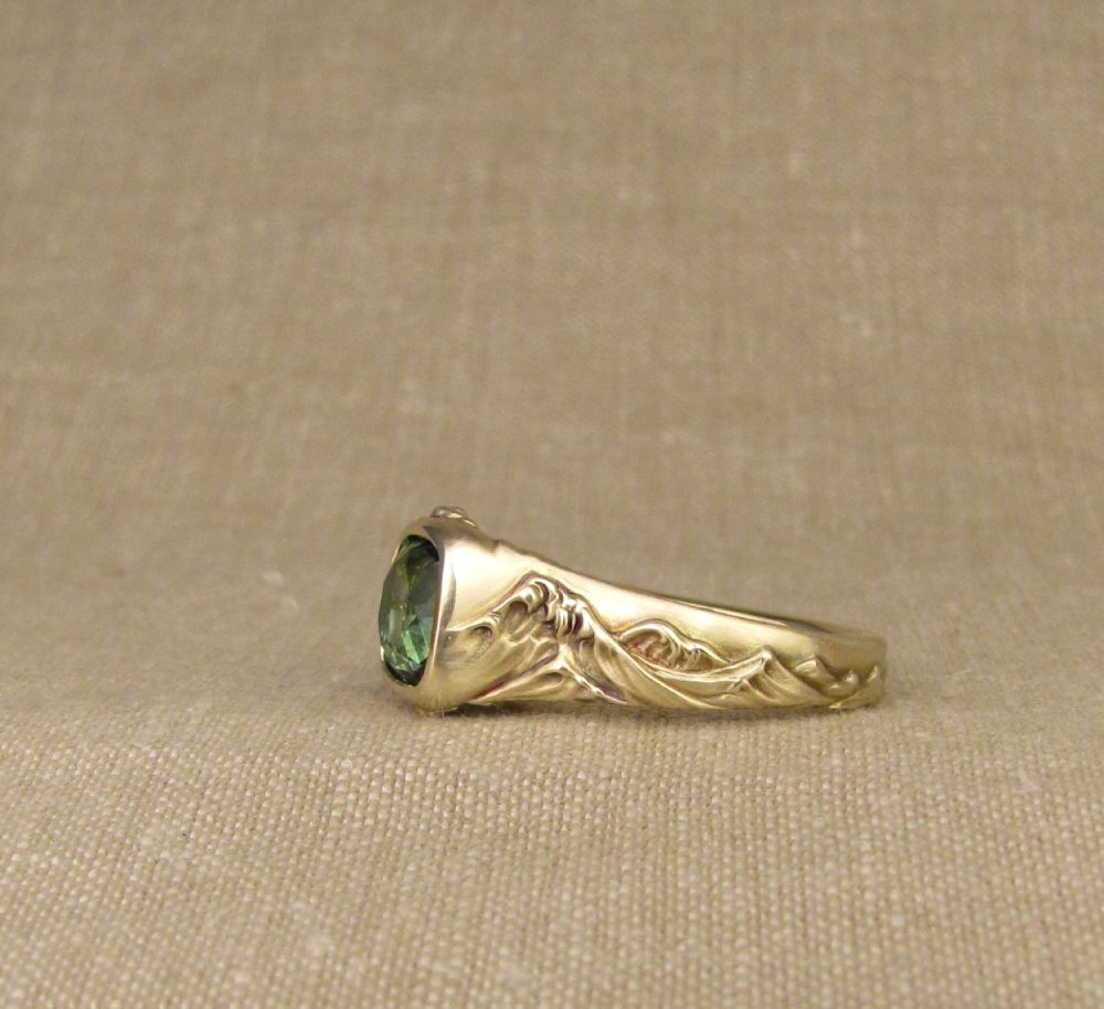 Hand-carved Hokusai-inspired Great Wave solitaire with blue-green tourmaline, 14K yellow gold