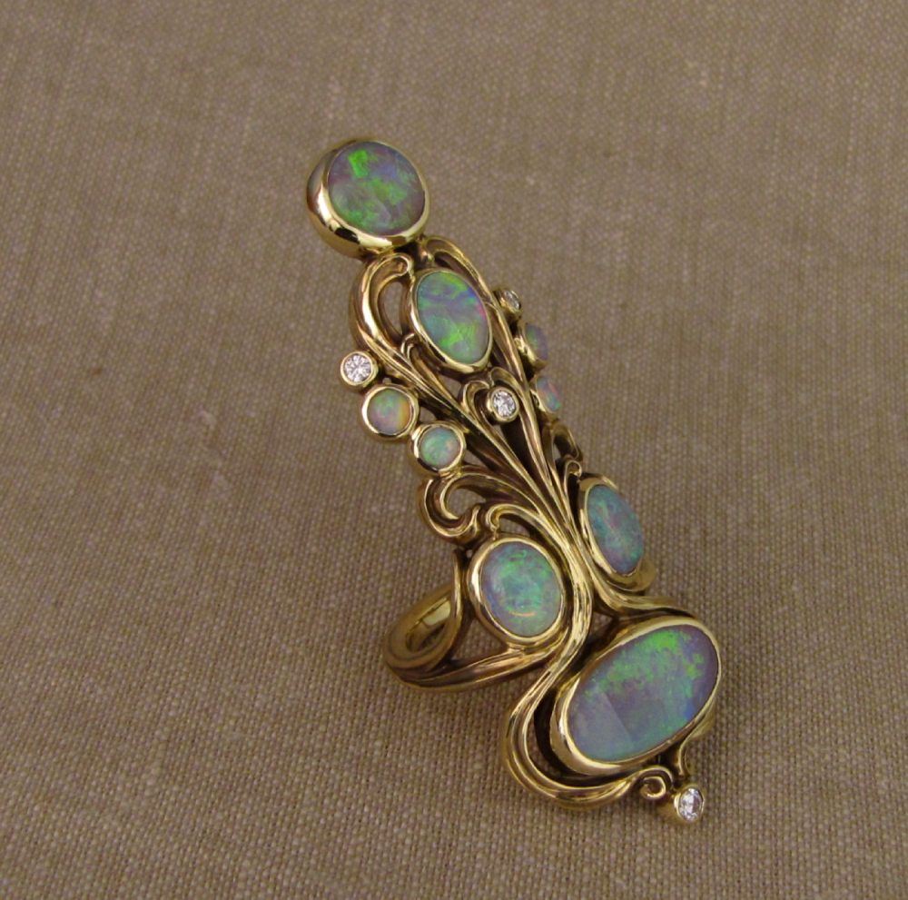 Hand-carved art nouveau Opal and 18K gold epic ring