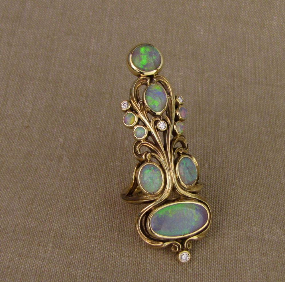 Hand-carved art nouveau Opal and 18K gold epic ring