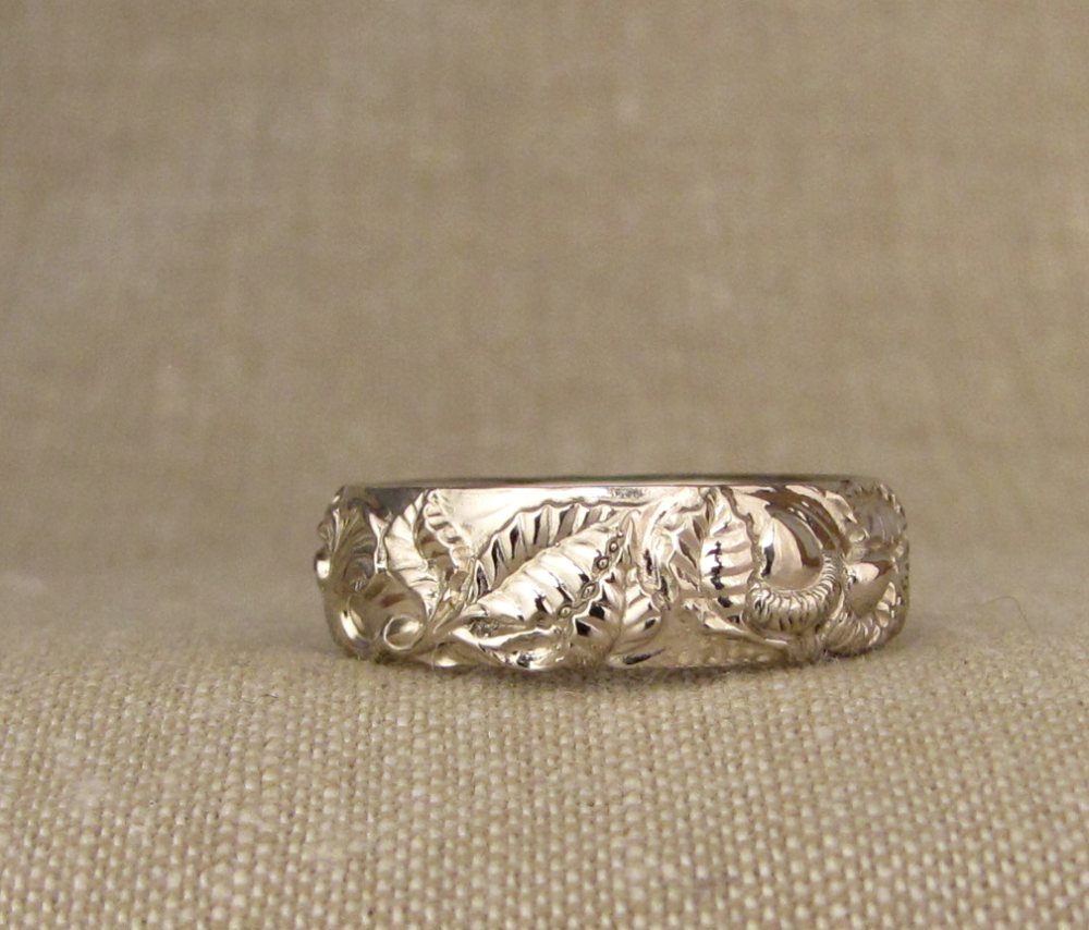 Custom hand-carved wedding bands with Tanoak/Chanterelle/California Poppy motifs, 14K palladium white gold