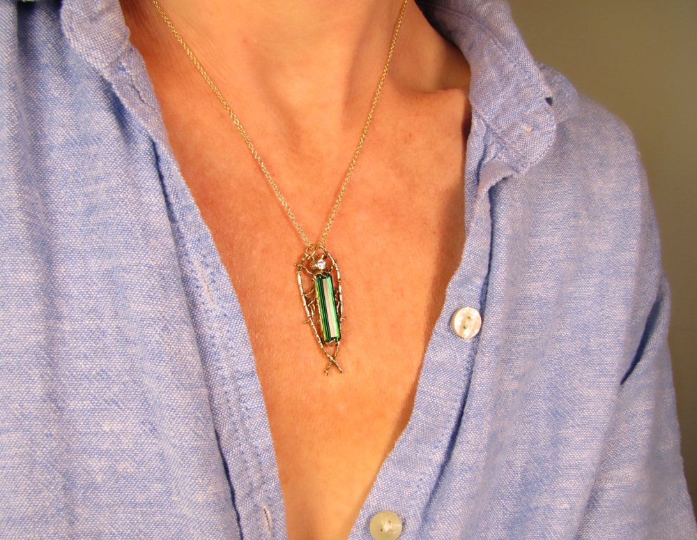 Hand-carved Fantastic Jeweled Insect pendant with elongated bluish-green tourmaline and diamond in 18K yellow gold