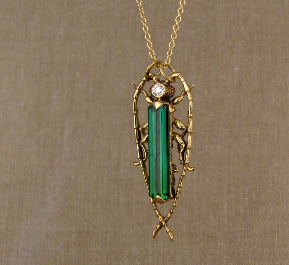 Hand-carved Fantastic Jeweled Insect pendant with elongated bluish-green tourmaline and diamond in 18K yellow gold