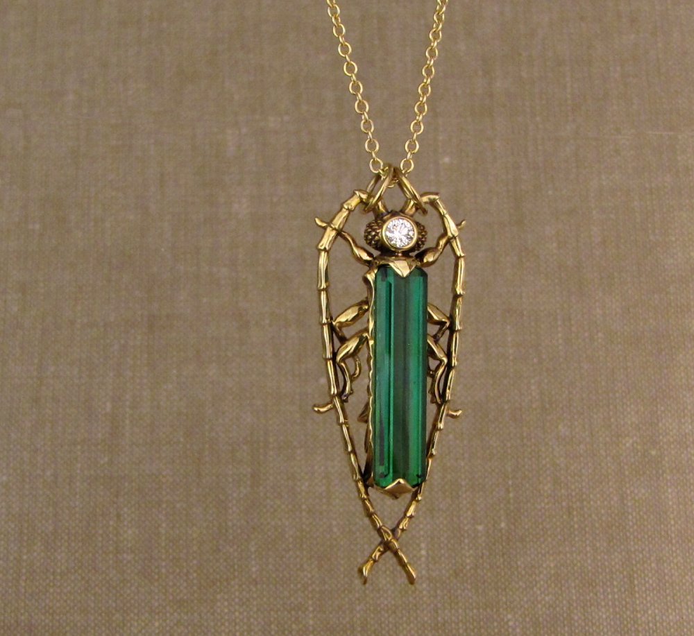 Hand-carved Fantastic Jeweled Insect pendant with elongated bluish-green tourmaline and diamond in 18K yellow gold
