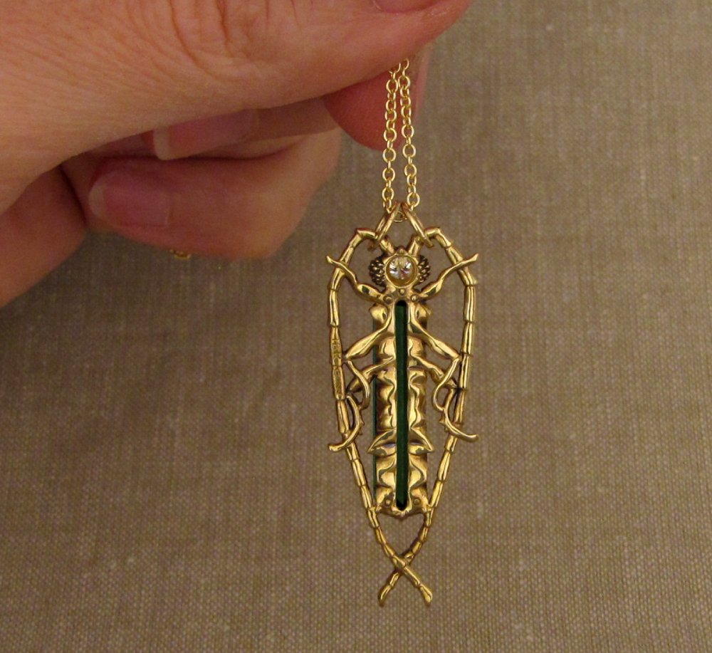 Hand-carved Fantastic Jeweled Insect pendant with elongated bluish-green tourmaline and diamond in 18K yellow gold