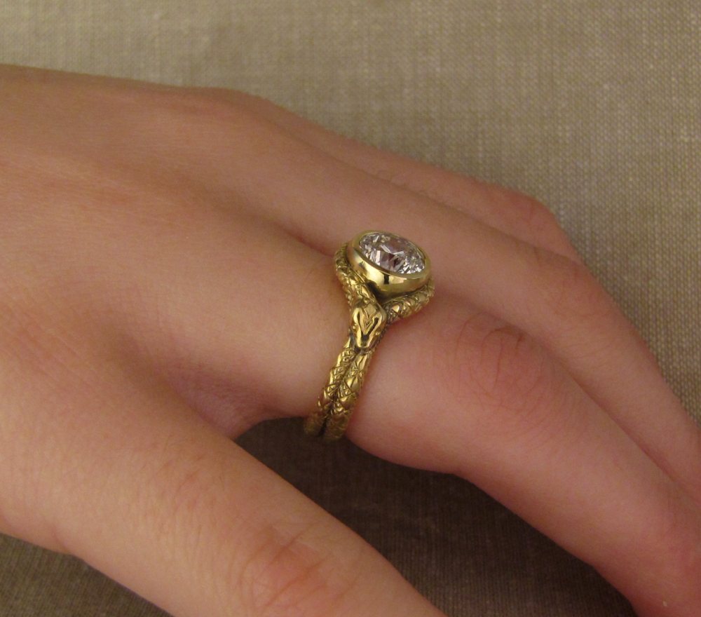 Custom designed, hand-carved Coiled Snake Solitaire in 18K gold with diamond