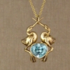 Bosch-birds pendant with blue zircon