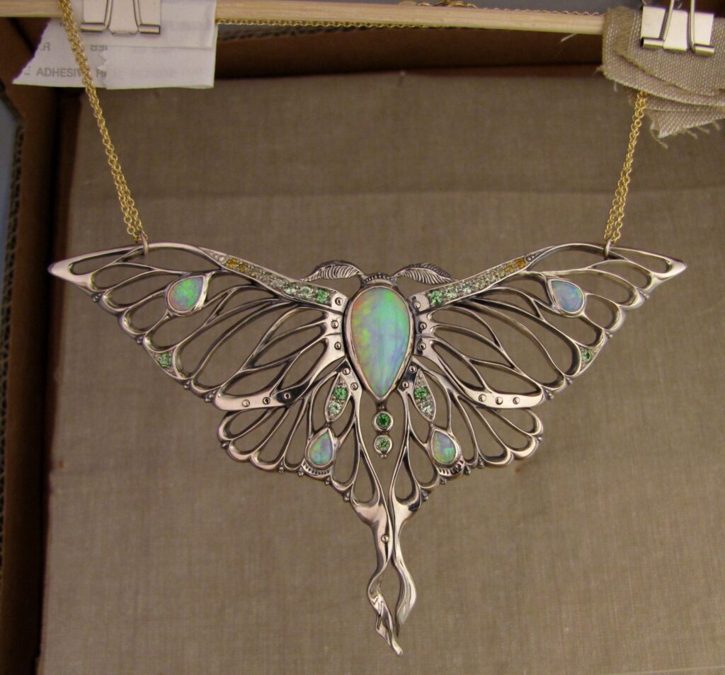 Luna Moth pendant/neckpiece with opals, sapphires, and tsavorite garnets, 14K white gold. cheyenne weil jewelry