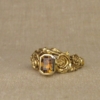 Warm rose ring with amber-colored garnet