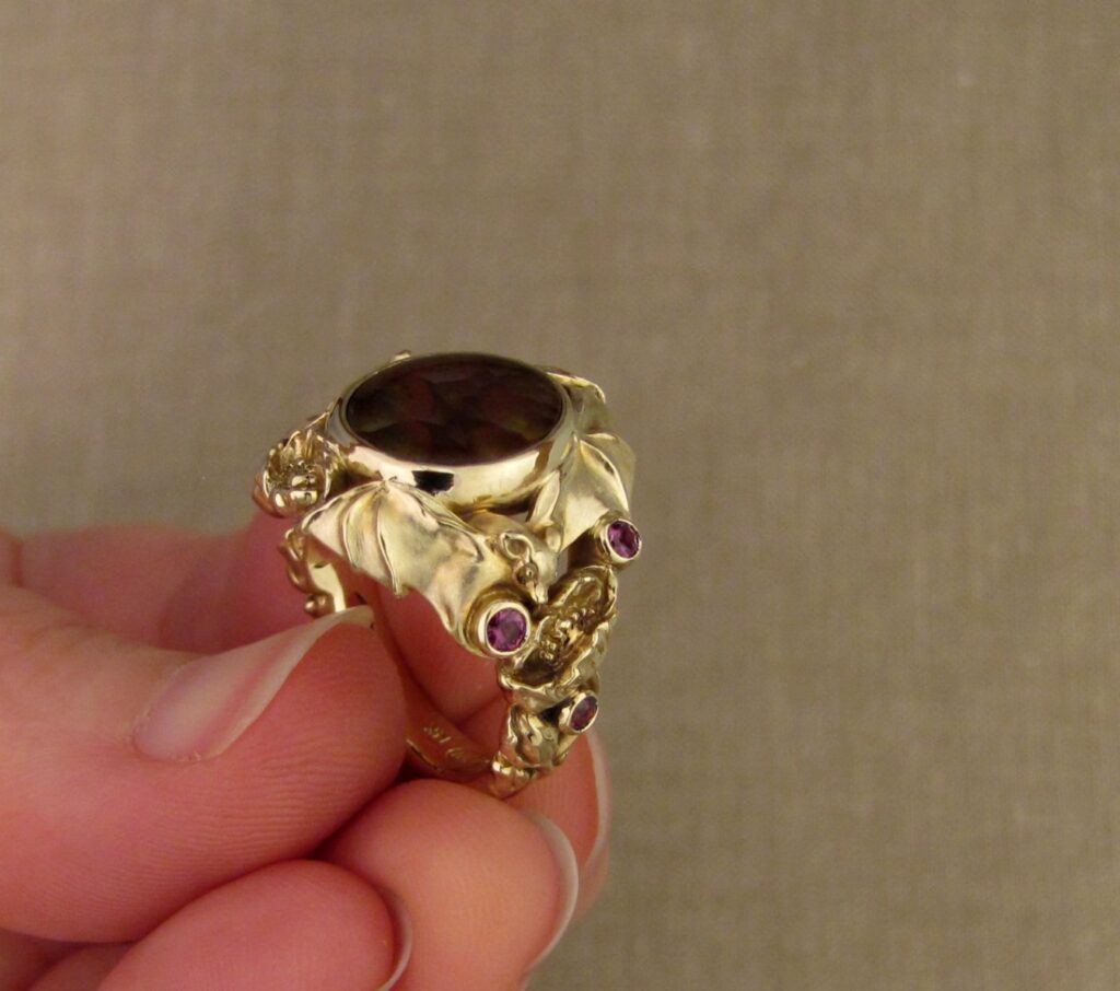 Bats & Poppies Ring, set with a fire agate and berry-colored garnets, 14K gold, cheyenne weil jewelry