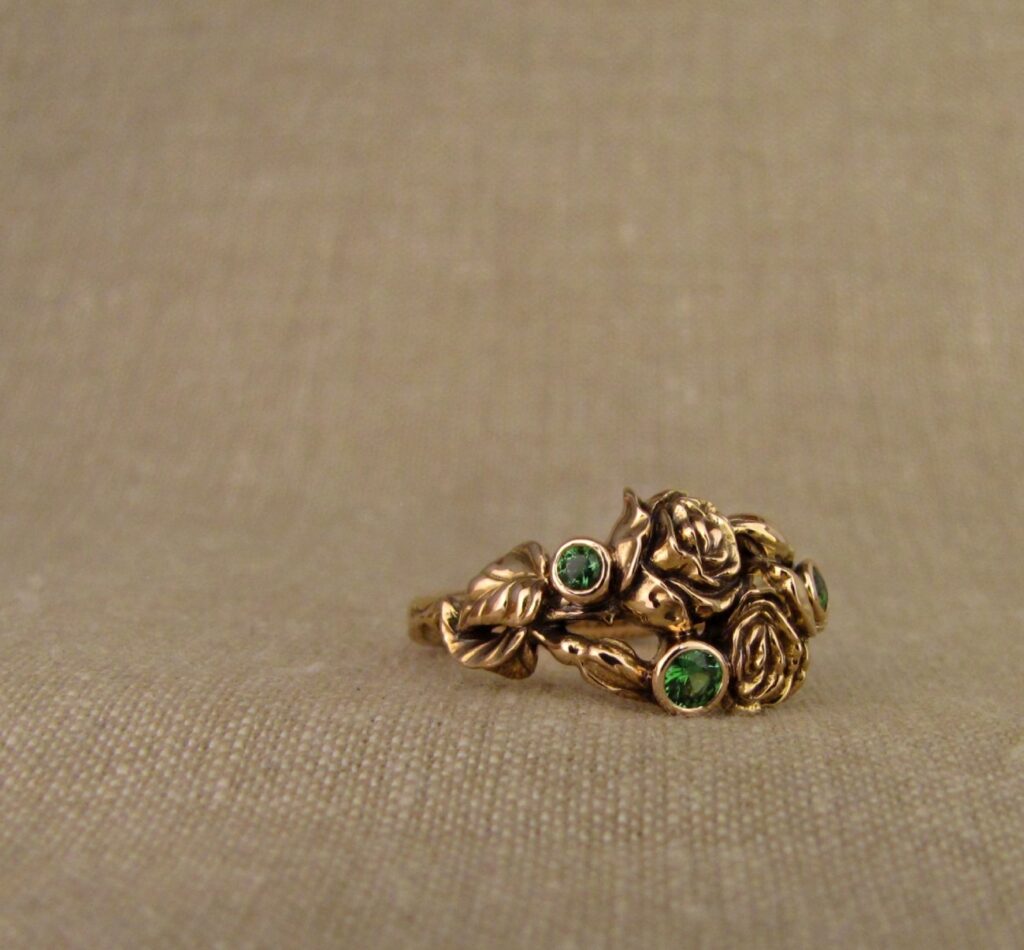 Pair of Roses ring in 19K rose gold, set with tsavorite garnets, cheyenne weil jewelry