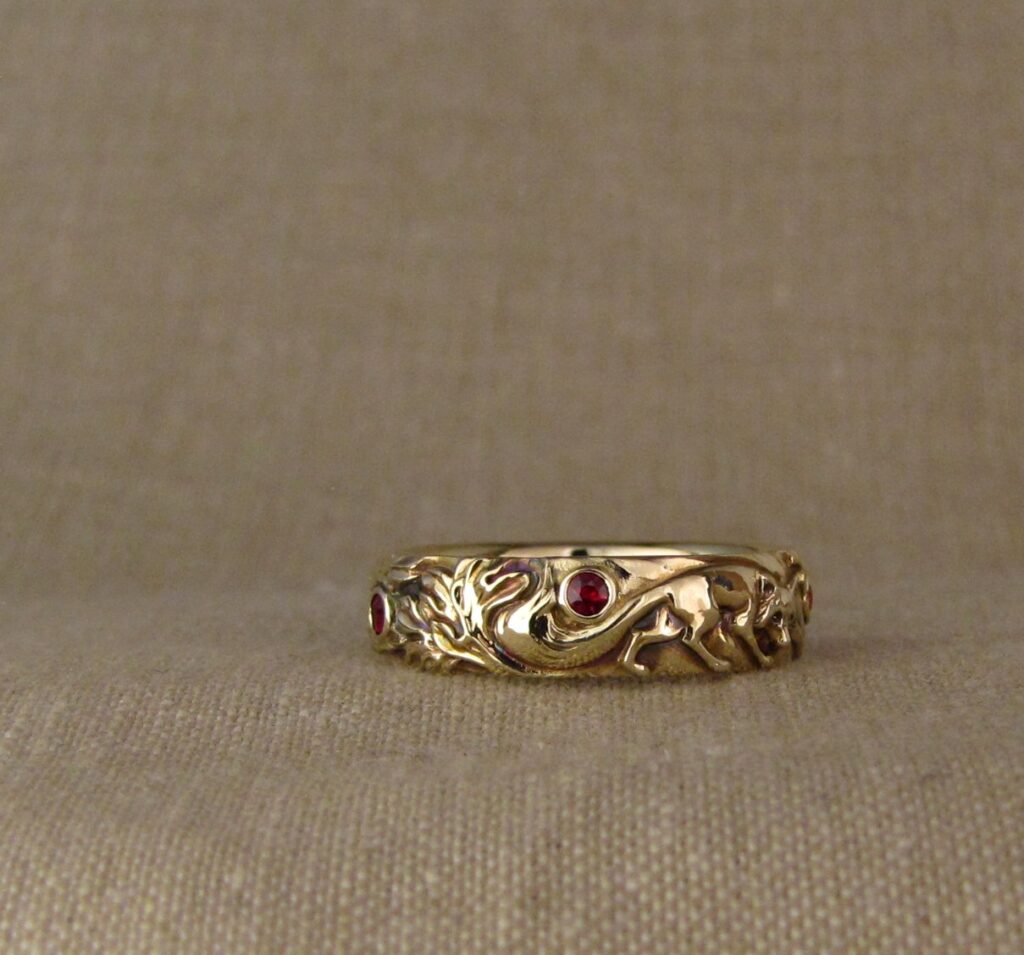 Wedding band carved with fox, tree of life, oak leaves, rococo-leaf motif, set with rubies, 14K gold, cheyenne weil jewelry