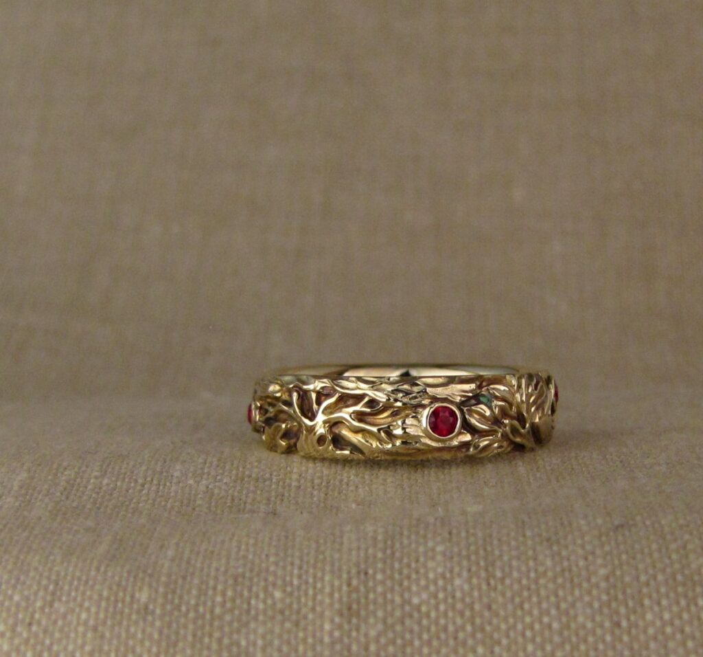 Wedding band carved with fox, tree of life, oak leaves, rococo-leaf motif, set with rubies, 14K gold, cheyenne weil jewelry