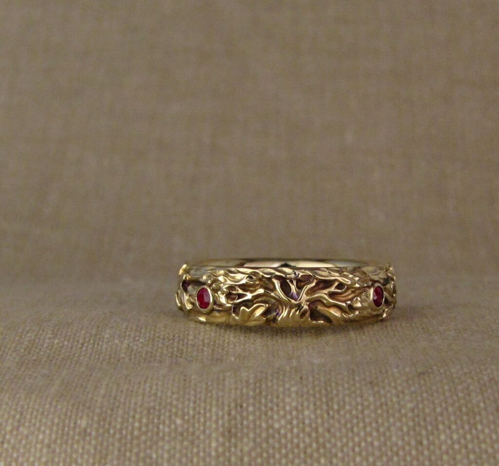 Wedding band carved with fox, tree of life, oak leaves, rococo-leaf motif, set with rubies, 14K gold, cheyenne weil jewelry