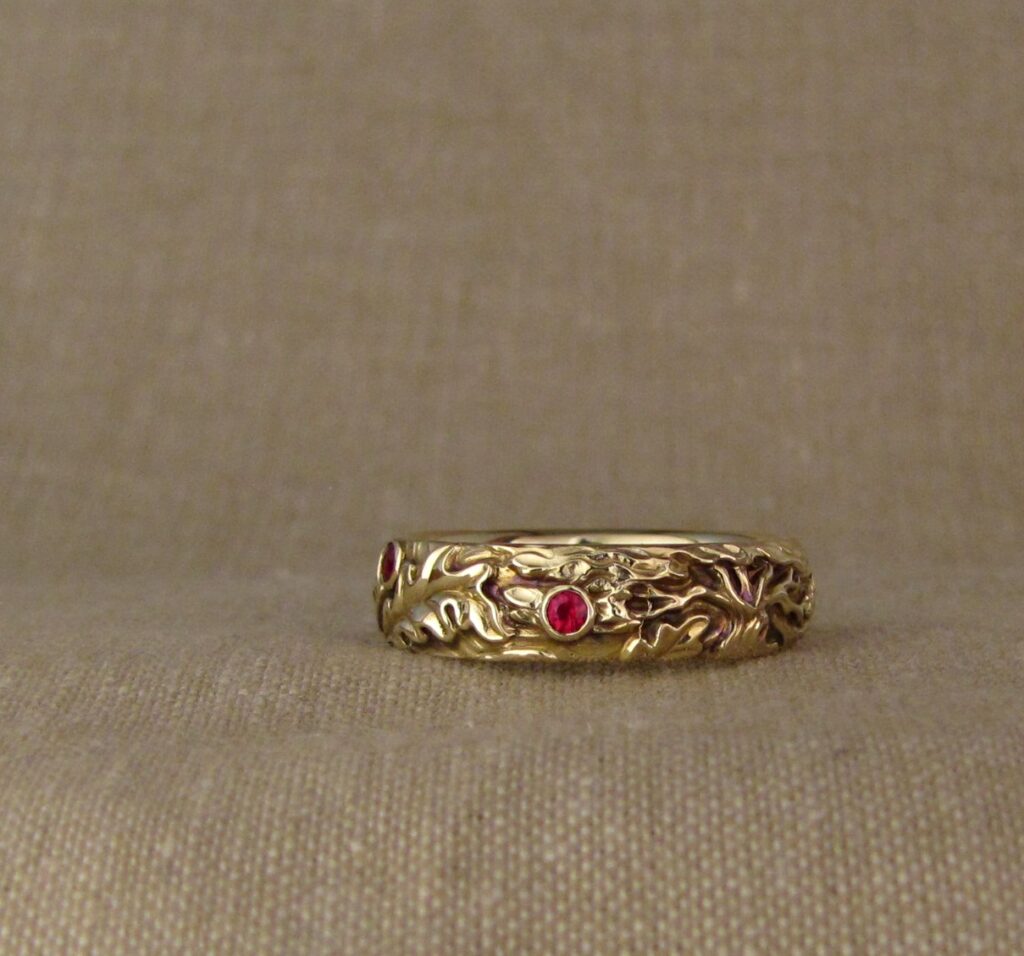 Wedding band carved with fox, tree of life, oak leaves, rococo-leaf motif, set with rubies, 14K gold, cheyenne weil jewelry