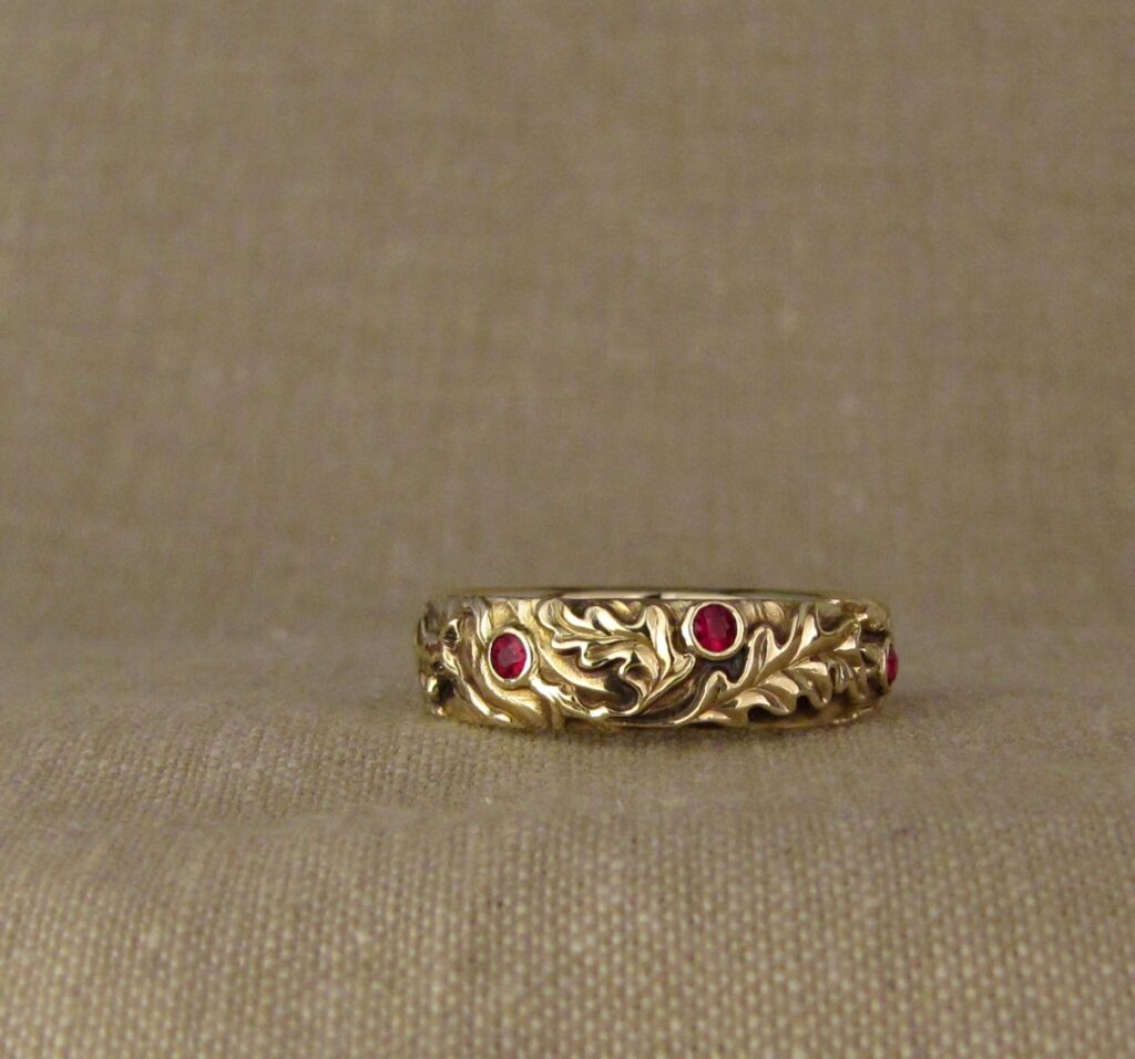 Wedding band carved with fox, tree of life, oak leaves, rococo-leaf motif, set with rubies, 14K gold, cheyenne weil jewelry