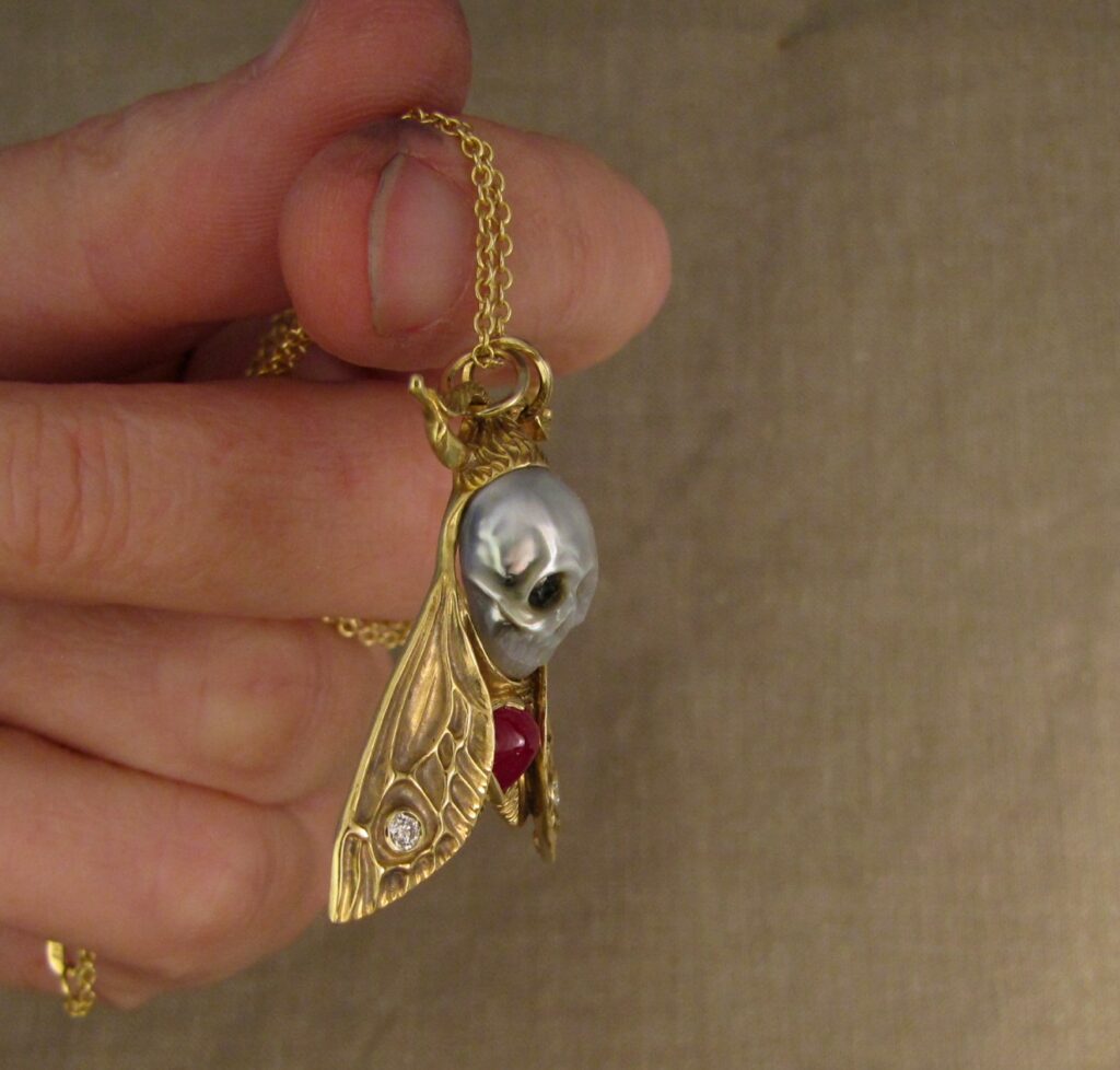 Hand-carved Death's Head Hawkmoth Memento Mori pendant, carved pearl skull, ruby, diamonds, 18K, cheyenne weil jewelry