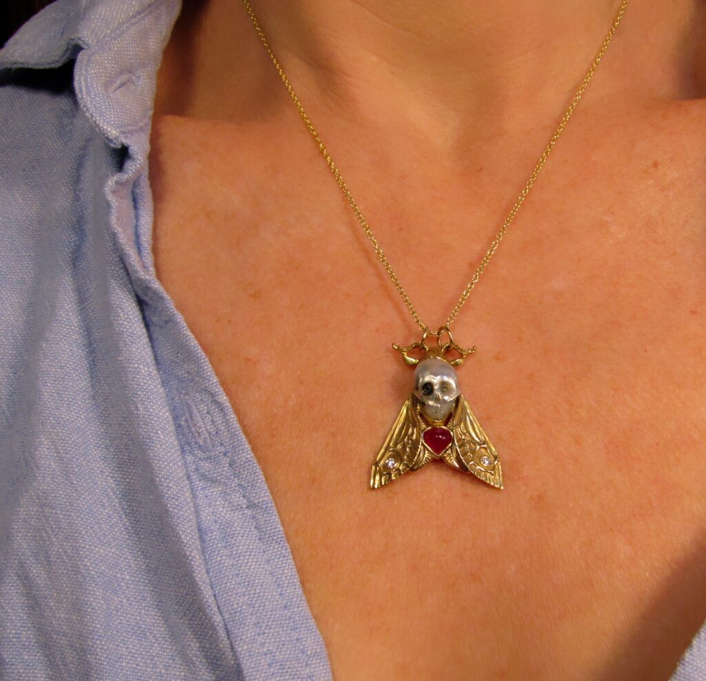 Hand-carved Death's Head Hawkmoth Memento Mori pendant, carved pearl skull, ruby, diamonds, 18K, cheyenne weil jewelry